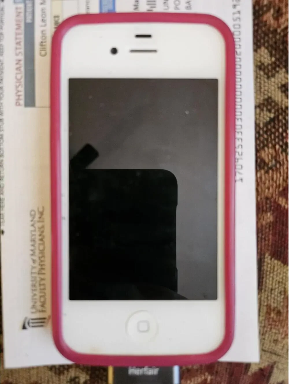 Apple iPhone 3 (i think) - White- charges and powers on. Working.
